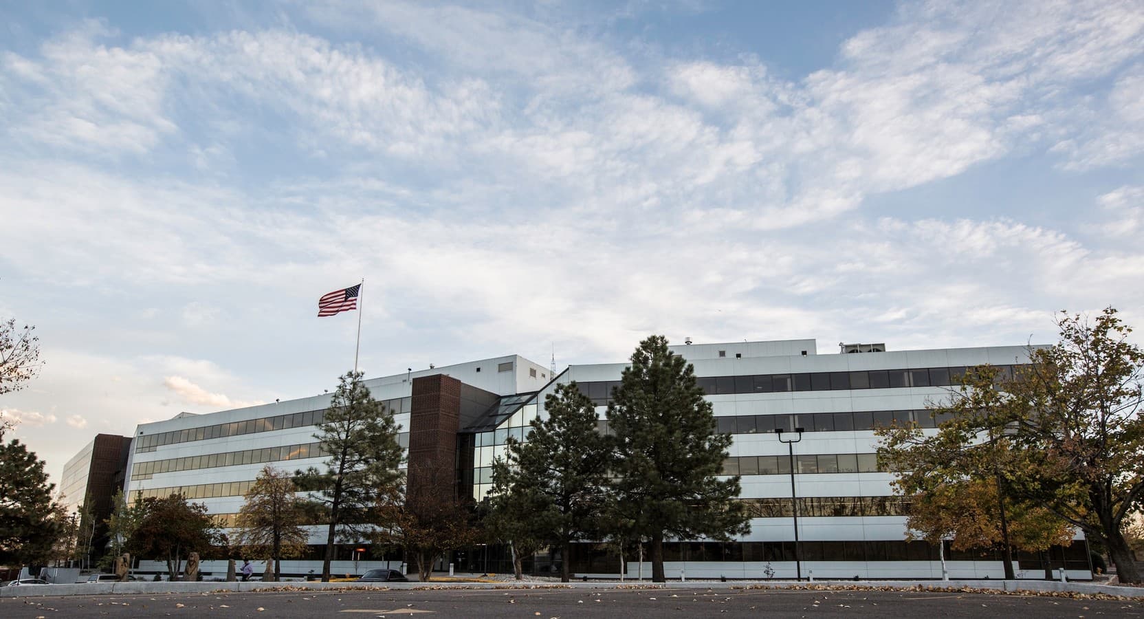 Office building under a wide Colorado sky